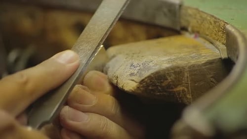 Italian Goldsmith at work building an engagement or a wedding ring.