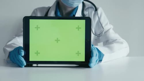 Green Screen Physician Therapist Pediatrician Demonstrates That She Uses an Electronic Tablet to