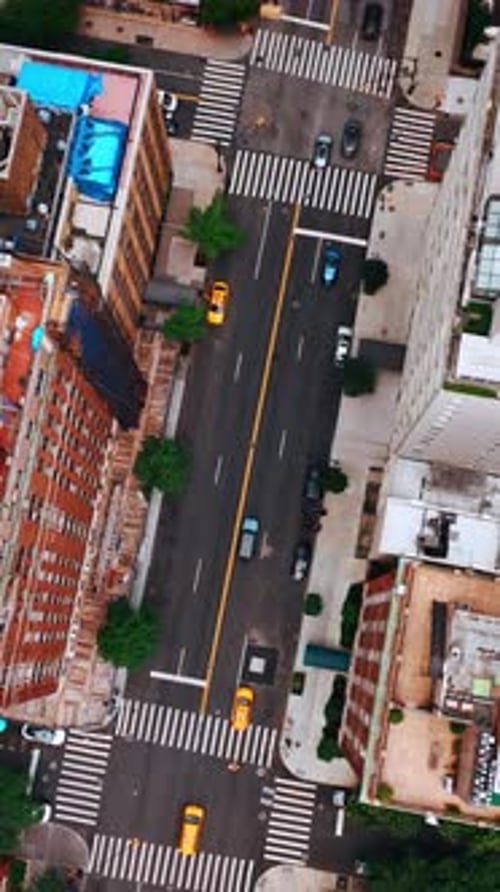 Descending above the road with crossroads. Aerial perspective of one of the New York districts