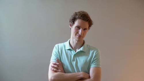 Confident Young Man with Arms Crossed