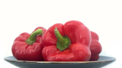 Fresh Red Bell Peppers on a Plate
