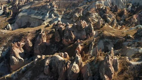 Unique Cappadocia landscape, sandstone pillar formations in Turkey. Aerial pan