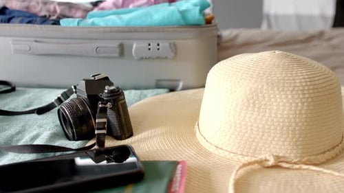A suitcase lies open with travel essentials