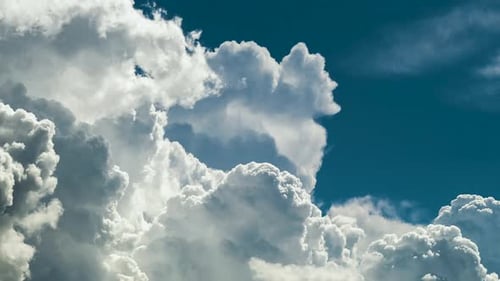 Timelapse of White Puffy Cumulus Clouds Forming on Summer Blue Sky