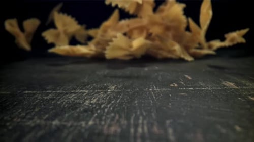 Dry Pasta Falls on the Table Filmed on a Highspeed Camera at 1000 Fps