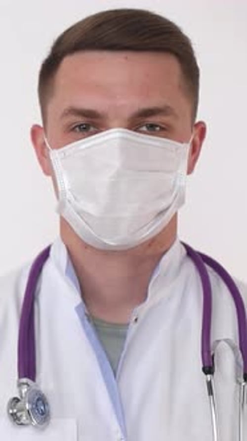Young Doctor Wearing a Surgical Mask and Stethoscope