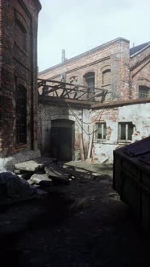 Weathered Factory With Numerous Windows Vertical