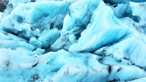 Cinematic Drone View of the Sharp Ice Ridges of Glacier Blue Ice Natural Landscape of the Icelandic
