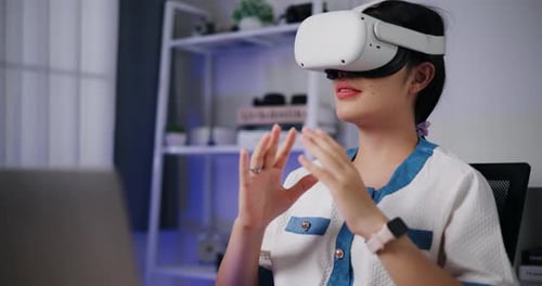 Woman Experiencing Virtual Reality with Headset Indoors