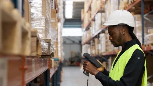 Warehouse Worker Scanning Packages in Slow Motion