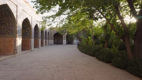 Sunset view of garden at courtyard of the Shah Mosque