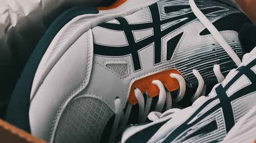 Pair of New White Sport Shoes in the Box