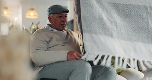 Old couple, laugh and playful conversation in home, support and blanket for comfort in lounge