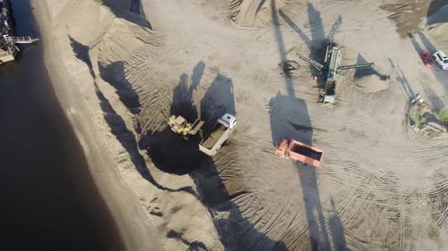 Aerial Top View of Trucks and Machinery in the Sand Quarry
