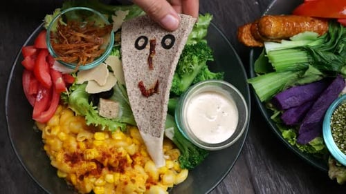 Creative Salad Bowl Preparation with Decorated Bread