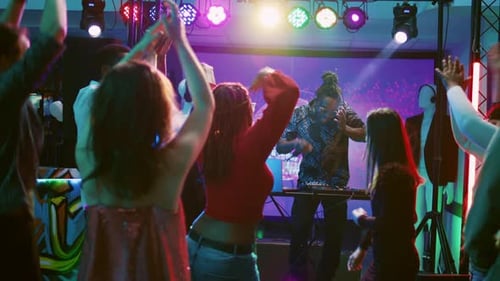 DJ Wearing Headset on Stage at Party