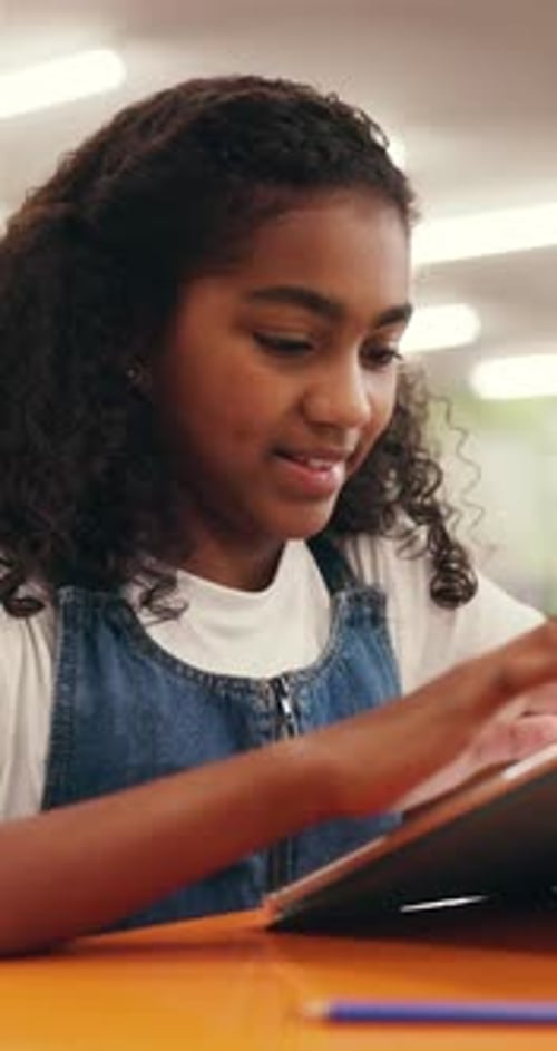 Girl, student or scroll with tablet in school for story, elearning or literature in library