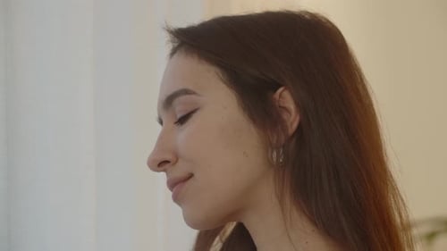 Young Adult Woman Drinking from a Glass