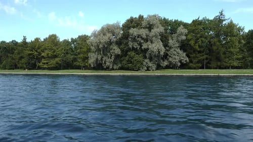 Sailing Along The River Along The Park