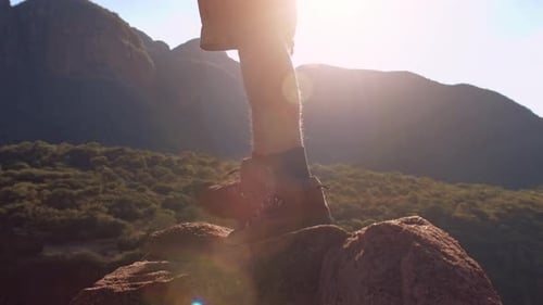 Thirsty Hiker Drinks Water at Sunset Summit
