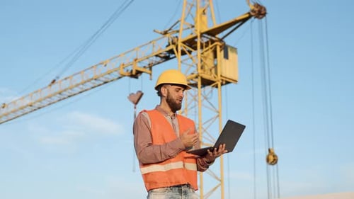 Construction Worker Video Calling Outside with Laptop