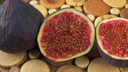 Fresh Figs Displayed on a Round Wooden Board