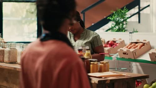Women Discussing Ingredients at Restaurant Counter