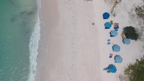 Elaxed Beach Environment With Vendors And Patterned Canopy Umbrellas