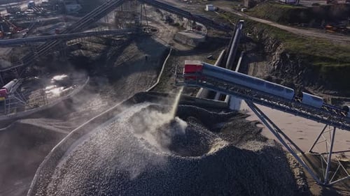 Large quarry site with rock processing and transport in action