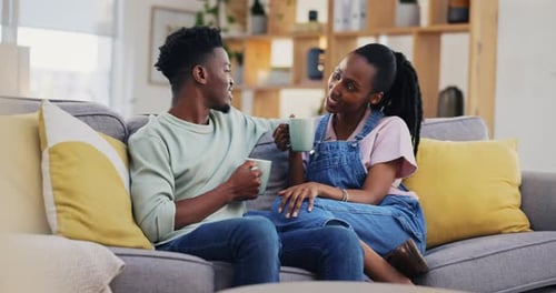 Woman and Man Chatting on Couch at Home