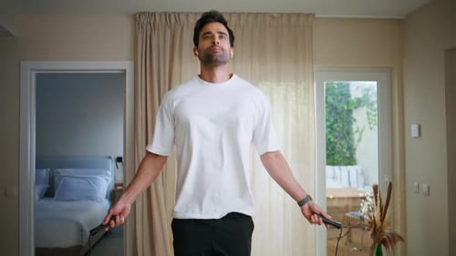Man Exercising, Jumping Rope in Modern Interior
