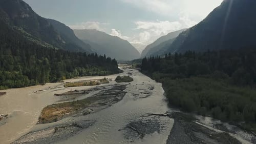 River Against the Backdrop of a Mountain Landscape and Forest