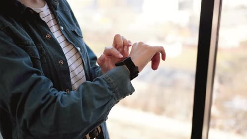 Crop of Female Office Worker Touching Smartwatch on Wrist