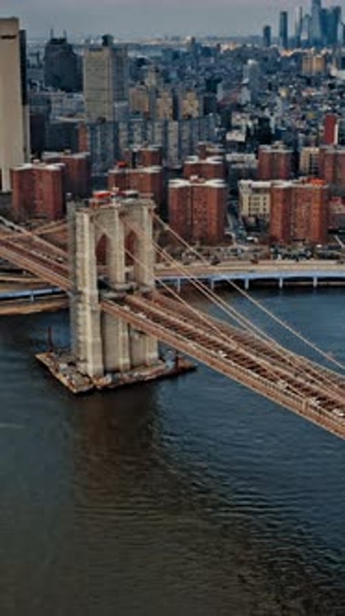 Aerial view of Brooklyn Bridge and surrounding urban landscape in New York