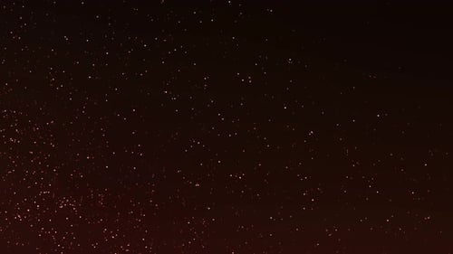 Glamour Collection: Tiny particles on dark red background shooting from bottom left corner