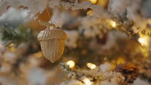 Golden Acorn Ornament Hanging on Christmas Tree