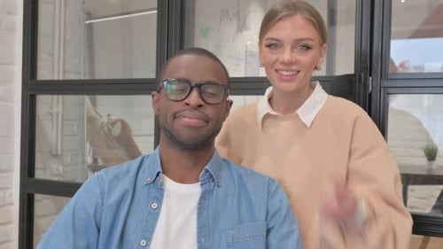 Colleagues Give Thumbs Up at the Office