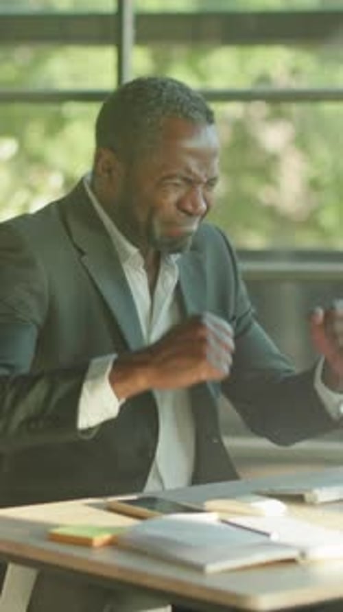 Manager Practices Meditation Near Workspace Window Serene Professional Relaxes Amid Busy Office