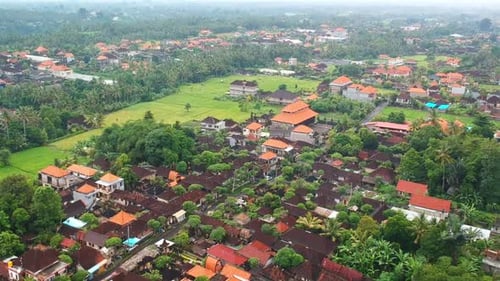 Aerial view of a little town in Bali, during a sunny day. Urban scenario over Ubud, Indonesia. Drone