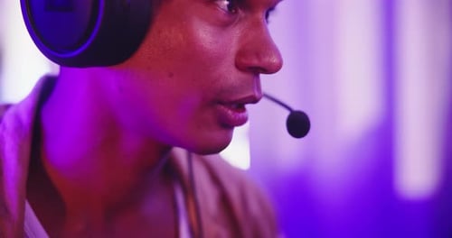 Young Adult with Headphones and Microphone Speaking