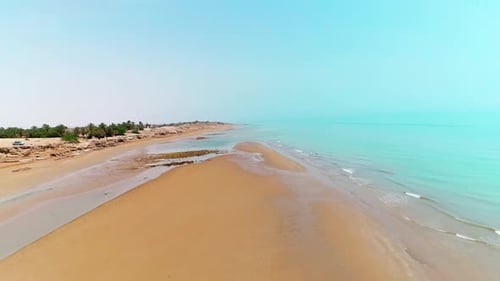 Aerial View of Pristine Coastal Cliffs and Sandy Beach