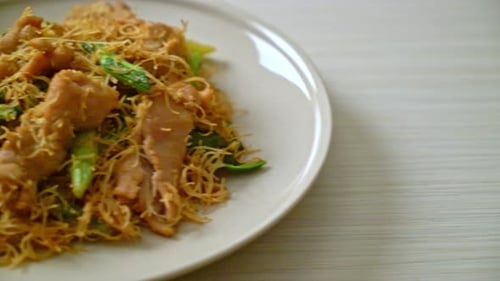 Plate of Fried Noodles with Meat and Greens