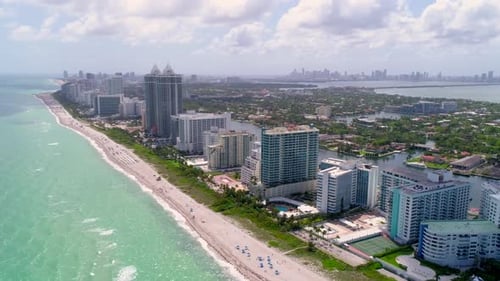 Miami beach flyover turquoise ocean waters and white sand beaches by drone