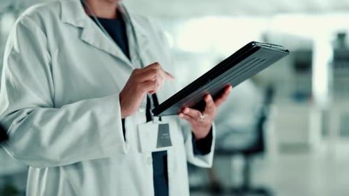 Doctor uses Tablet in Modern Lab Setting