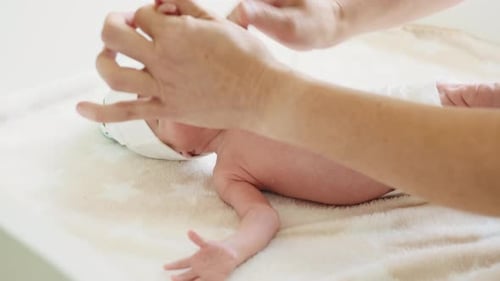 Loving Adult Interacts with Infant at Home