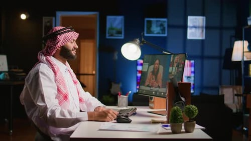 Man Works From Home on Computer Video Call