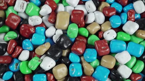 Rotating Colored Dragee Sea Pebbles.