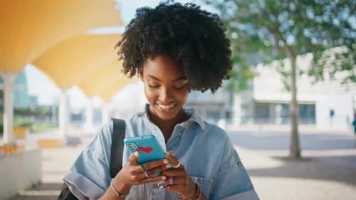 Cheerful Girl Reading Sms Looking Smartphone Screen on Sunny Street Close Up