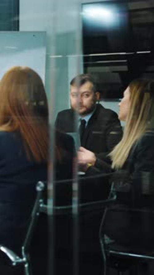 Vertical Screen Team of Business People at Meeting in Office