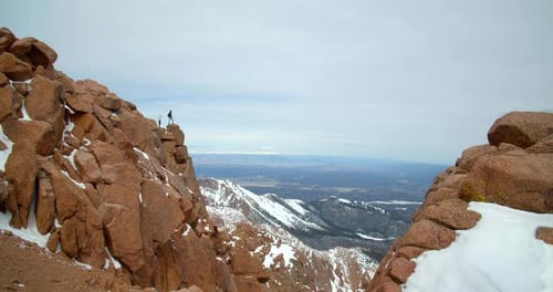 Hikers on Top of Rocky Mountains, Wide Landscape View From Peak Adventure